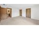 Bedroom with doors to bathroom; neutral carpet and modern wood doors at 1095 Lanier Pl, Cumming, GA 30041