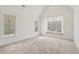 Bright bedroom features neutral carpet, white walls, and two large windows at 1095 Lanier Pl, Cumming, GA 30041