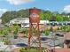 The City Center features a water tower and multiple businesses, and many parking spots for visitors of the shops at 1095 Lanier Pl, Cumming, GA 30041