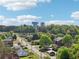 Scenic view of Cumming, GA, featuring prominent water towers against a backdrop of lush greenery and clear skies at 1095 Lanier Pl, Cumming, GA 30041
