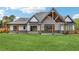 Expansive backyard with patio, highlighting the home's stylish exterior design and spacious outdoor living area at 1095 Lanier Pl, Cumming, GA 30041