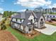 Beautiful exterior with a landscaped yard, a long driveway, and impeccable design, making it a standout property in the neighborhood at 1095 Lanier Pl, Cumming, GA 30041