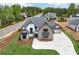 Striking home exterior with a spacious driveway and professional landscaping enhancing curb appeal and property value at 1095 Lanier Pl, Cumming, GA 30041