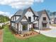 Impressive home exterior featuring a well-manicured lawn, tasteful landscaping, and a welcoming entrance for guests and residents at 1095 Lanier Pl, Cumming, GA 30041