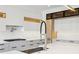 Modern kitchen featuring a stainless steel faucet and matching appliances at 1095 Lanier Pl, Cumming, GA 30041