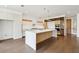 Spacious kitchen with a large center island and hardwood floors at 1095 Lanier Pl, Cumming, GA 30041