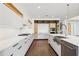 Bright kitchen showcasing stainless steel appliances, a spacious layout, and modern white cabinets at 1095 Lanier Pl, Cumming, GA 30041