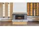 Inviting living room featuring a stone fireplace and custom built-ins at 1095 Lanier Pl, Cumming, GA 30041