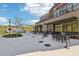 Outdoor seating area with tables, chairs, and views of the surrounding landscape, including a Tin Cup Grill at 1095 Lanier Pl, Cumming, GA 30041