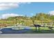 A modern playground designed with fun and safety in mind, surrounded by lush greenery, and open skies at 1095 Lanier Pl, Cumming, GA 30041