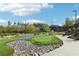 Lush putting green with decorative rocks, landscaping, and walking paths for golfers of all skill levels at 1095 Lanier Pl, Cumming, GA 30041