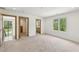 Open room with soft carpet, light-colored walls, and multiple doorways offering a spacious feel at 1095 Lanier Pl, Cumming, GA 30041