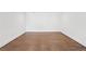 An empty, light-filled room with hardwood floors offering space for an office or living area at 1095 Lanier Pl, Cumming, GA 30041