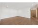 A light and airy room with hardwood floors, recessed lighting, and modern doors at 1095 Lanier Pl, Cumming, GA 30041