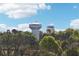 Scenic view of Cumming water towers against a bright sky and lush greenery at 1095 Lanier Pl, Cumming, GA 30041