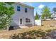 View of the backyard with patio, exterior door and grassy area, perfect for outdoor enjoyment at 136 Grant Dr, Canton, GA 30114