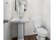 Elegant powder room featuring a pedestal sink and modern fixtures at 136 Grant Dr, Canton, GA 30114
