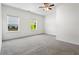Bright bedroom with two windows and a ceiling fan at 136 Grant Dr, Canton, GA 30114
