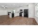 Open concept kitchen with stainless steel appliances, island, and hardwood floors at 136 Grant Dr, Canton, GA 30114