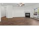 Spacious living room featuring a fireplace and a ceiling fan at 136 Grant Dr, Canton, GA 30114