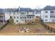 Aerial view of the backyard with a fire pit and seating area at 3945 Starwood Dr, Cumming, GA 30028