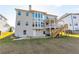 Back exterior featuring a spacious yard, deck, and access stairs at 3945 Starwood Dr, Cumming, GA 30028