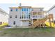 A view of the rear of the house with a deck and large windows at 3945 Starwood Dr, Cumming, GA 30028