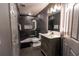 Modern bathroom with marble shower, glass doors, vanity, and luxurious lighting fixtures at 3945 Starwood Dr, Cumming, GA 30028