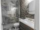 Modern bathroom featuring a glass-enclosed shower, stylish vanity with gold faucet, and contemporary decor at 3945 Starwood Dr, Cumming, GA 30028