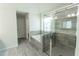 Bathroom featuring large walk-in shower and free-standing tub with designer tile at 3945 Starwood Dr, Cumming, GA 30028