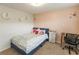 Bright bedroom featuring colorful decorations, a cozy bed, and a functional desk space at 3945 Starwood Dr, Cumming, GA 30028