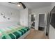 Cozy bedroom with ceiling fan, ensuite bathroom, neutral carpet, and bright decor; a perfect personal retreat at 3945 Starwood Dr, Cumming, GA 30028
