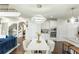 Dining area features a modern chandelier, seating for six, and connects the kitchen and living spaces at 3945 Starwood Dr, Cumming, GA 30028