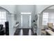 Bright and airy foyer with hardwood floors, arched doorways, and elegant decor at 3945 Starwood Dr, Cumming, GA 30028