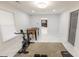Bright basement gym with exercise bike, foosball table, and modern finishes for a healthy lifestyle at 3945 Starwood Dr, Cumming, GA 30028