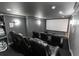 Enjoy movies in this home theater with plush seating and a large screen at 3945 Starwood Dr, Cumming, GA 30028
