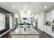 Open floor plan showcases kitchen island view of the living room and abundant natural light at 3945 Starwood Dr, Cumming, GA 30028