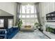 Spacious living room showcasing expansive windows, high ceilings, and comfortable seating, perfect for modern living at 3945 Starwood Dr, Cumming, GA 30028