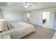 Bright main bedroom with access to en-suite bathroom and staircase to other floors at 3945 Starwood Dr, Cumming, GA 30028