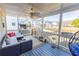 Relax on the covered porch with a comfortable seating area and backyard views at 3945 Starwood Dr, Cumming, GA 30028