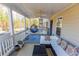 Enjoy relaxing on this covered porch with a swing and comfortable seating at 3945 Starwood Dr, Cumming, GA 30028