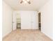 Neutral bedroom featuring ceiling fan, carpet and a door to the closet and another door to another space at 5672 Kingsport Dr # 4, Atlanta, GA 30342