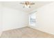 Unfurnished bedroom with large window and ceiling fan at 5672 Kingsport Dr # 4, Atlanta, GA 30342