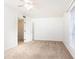 Bedroom with neutral carpet, ceiling fan, door, and window with blinds at 5672 Kingsport Dr # 4, Atlanta, GA 30342
