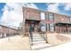 Brick townhome featuring dark shutters and trim, showcasing a classic and inviting facade at 5672 Kingsport Dr # 4, Atlanta, GA 30342