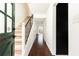 Inviting foyer featuring hardwood floors, stairs with iron railing and access to other rooms at 5672 Kingsport Dr # 4, Atlanta, GA 30342