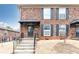 Charming brick townhome with a covered entrance, complemented by well-maintained landscaping at 5672 Kingsport Dr # 4, Atlanta, GA 30342
