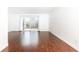 Bright living room featuring sliding glass door and wood floors overlooking outdoor patio at 5672 Kingsport Dr # 4, Atlanta, GA 30342