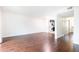 Spacious living area with hardwood floors providing access to the kitchen and hallway at 5672 Kingsport Dr # 4, Atlanta, GA 30342