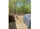 Backyard with furniture and an outdoor grill for entertaining at 1905 Rockmart Rd, Villa Rica, GA 30180